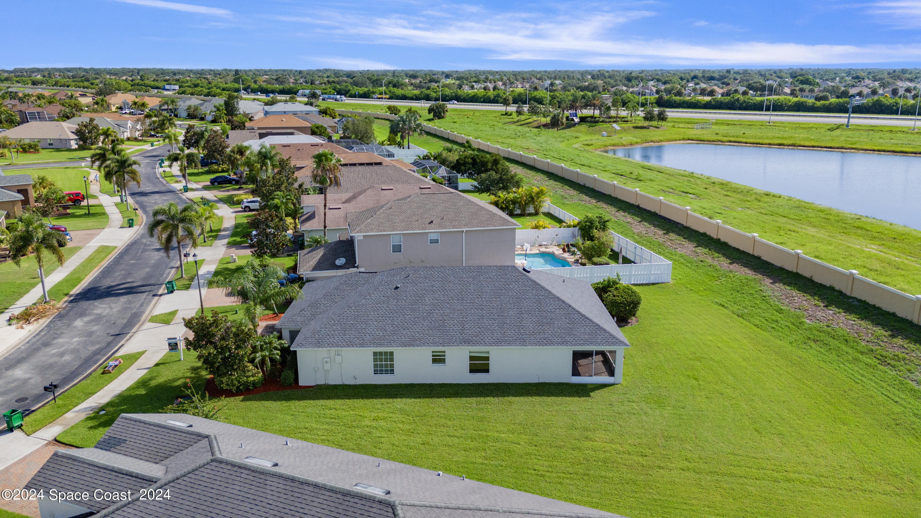 4220 Chardonnay Drive Rockledge, FL 32955 - Photo 47 of 51 an aerial view of a house with a swimming pool yard and outdoor seating