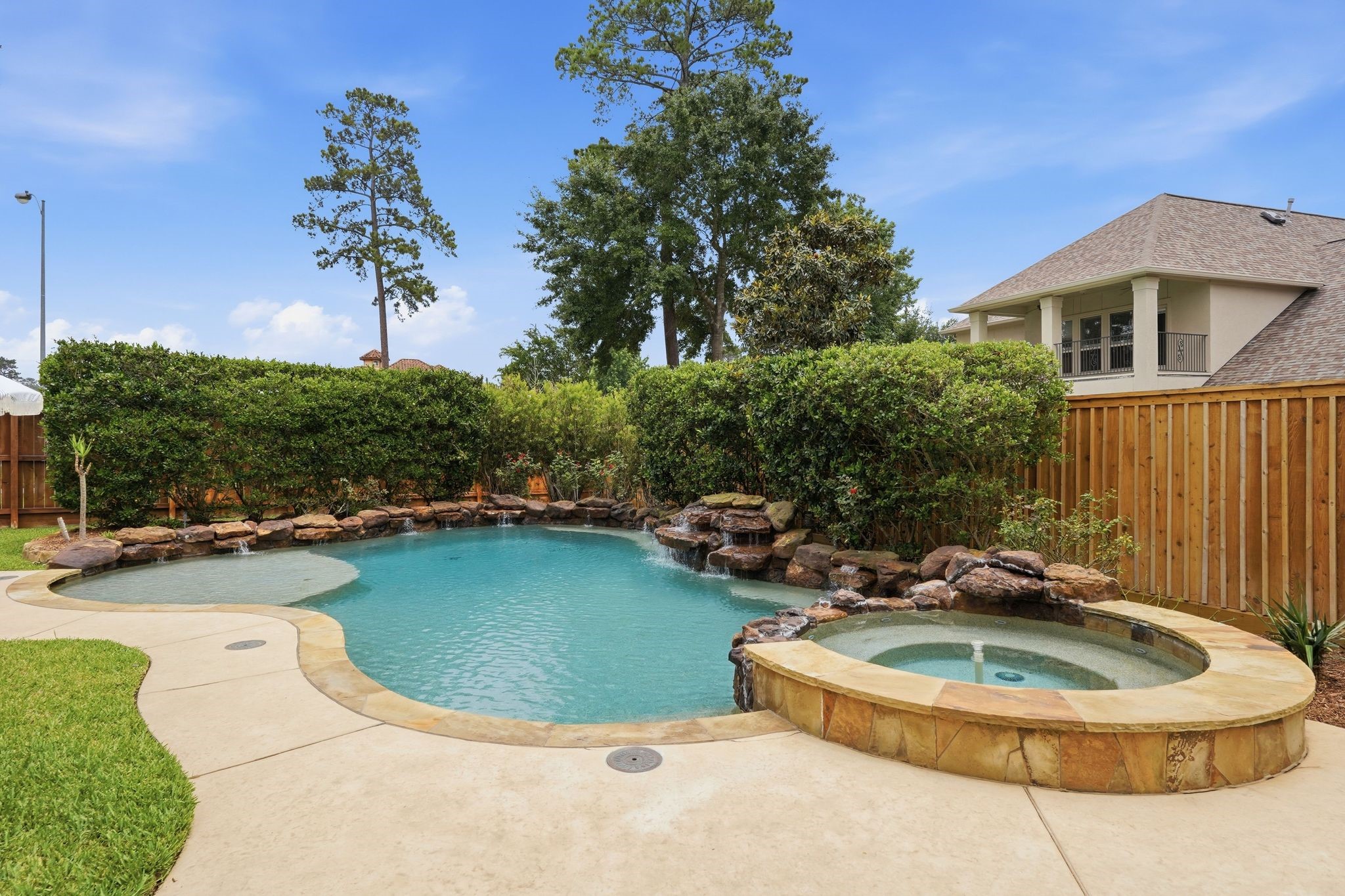 7603 Hogan Bridge Court Spring, TX 77389 - Photo 44 of 50 Enjoy added privacy as mature landscaping frames the pool.
