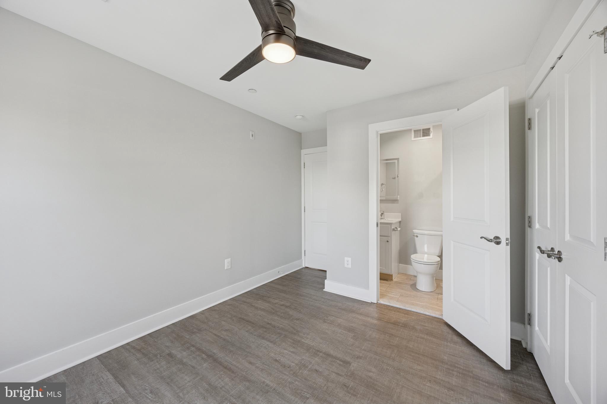502 Gerhard Street, Unit J Philadelphia, PA 19128 - Photo 12 of 25 wooden floor in an empty room with a window