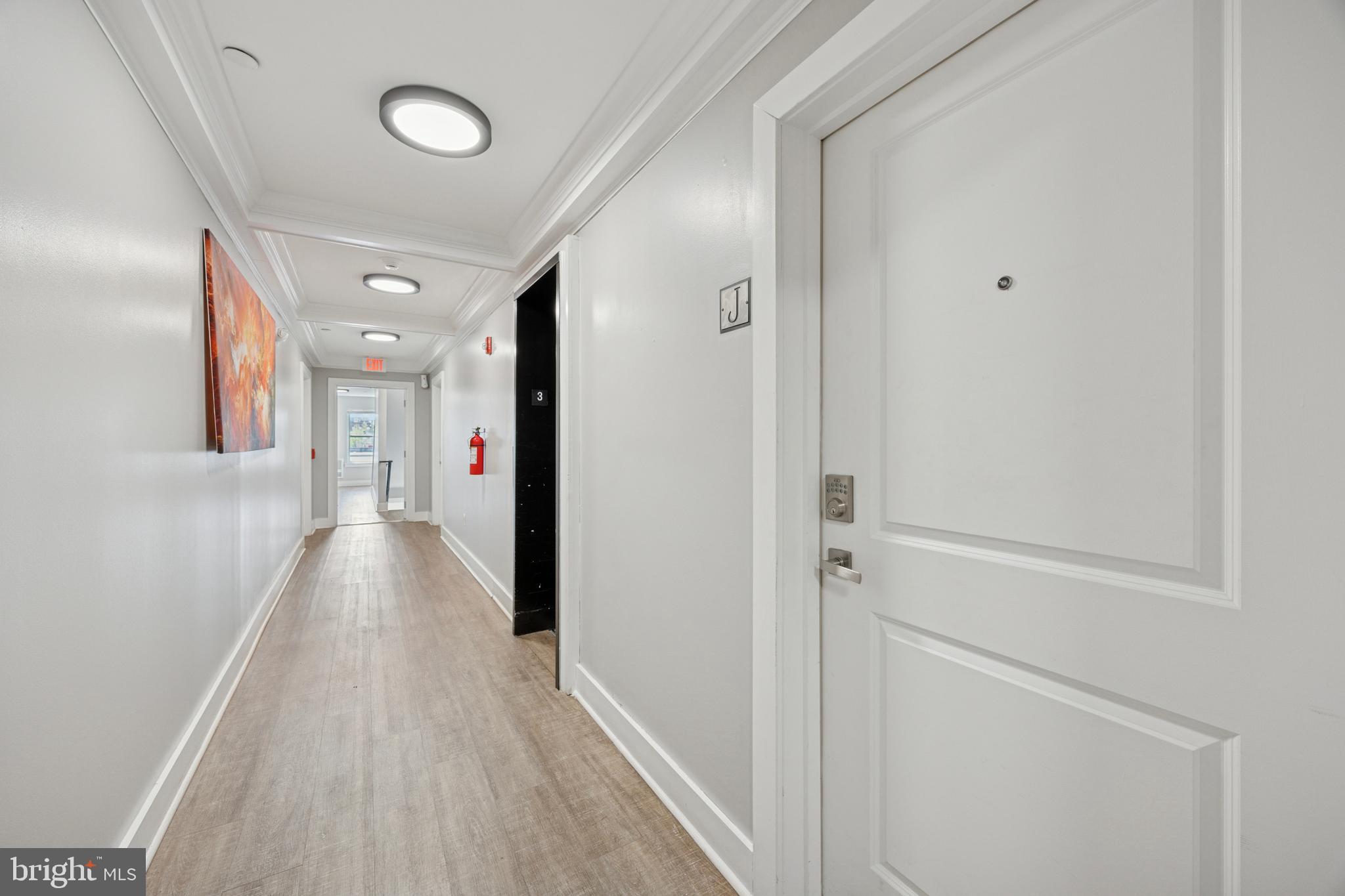 502 Gerhard Street, Unit J Philadelphia, PA 19128 - Photo 2 of 25 a view of a hallway with wooden floor