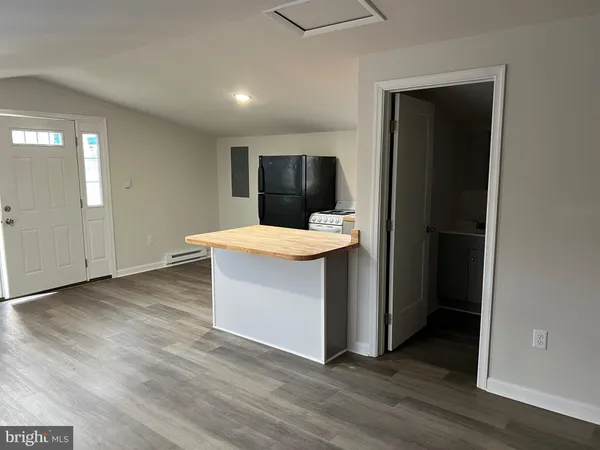 a room with wooden floor and utility room