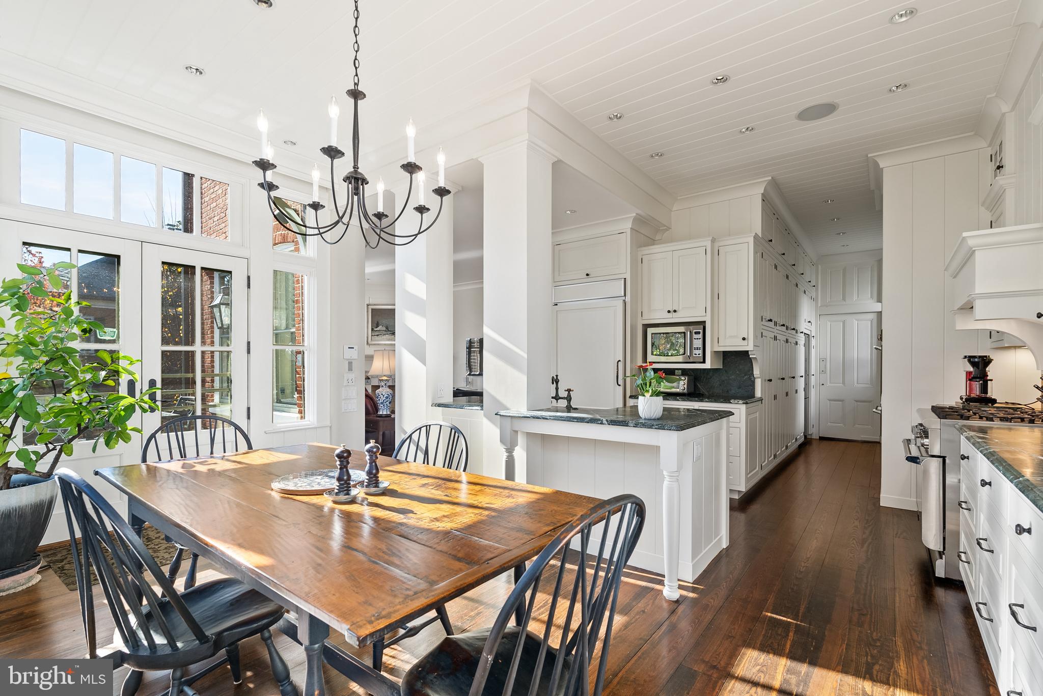 1601 28th Street Northwest Washington, DC 20007 - Photo 14 of 29 a large kitchen with a table and chairs