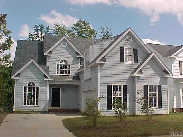 7924 Mill Run Raleigh, NC 27612 - Photo 1 of 1 a front view of a house with a yard