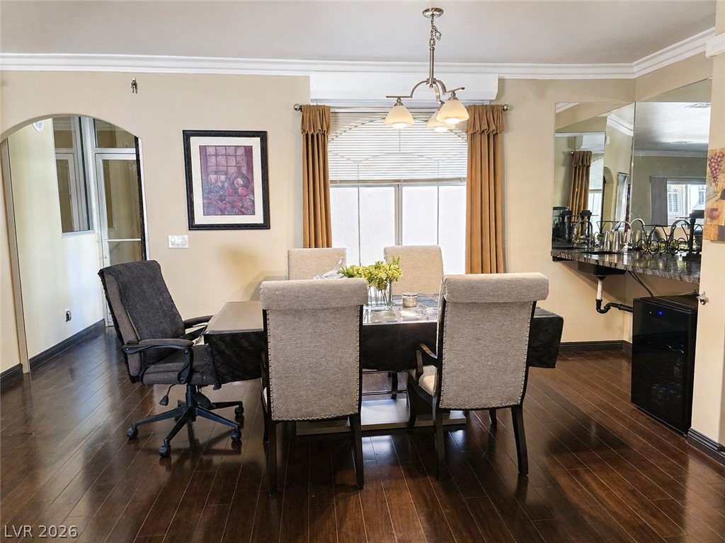 2050 West Warm Springs Road, Unit 2422 Henderson, NV 89014 - Photo 11 of 44 This versatile space features a dining area with elegant lighting and rich hardwood flooring.