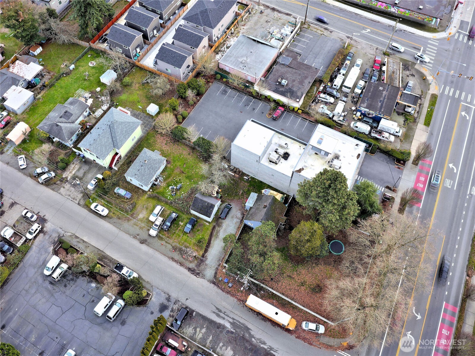 an aerial view of a residential apartment building with a yard