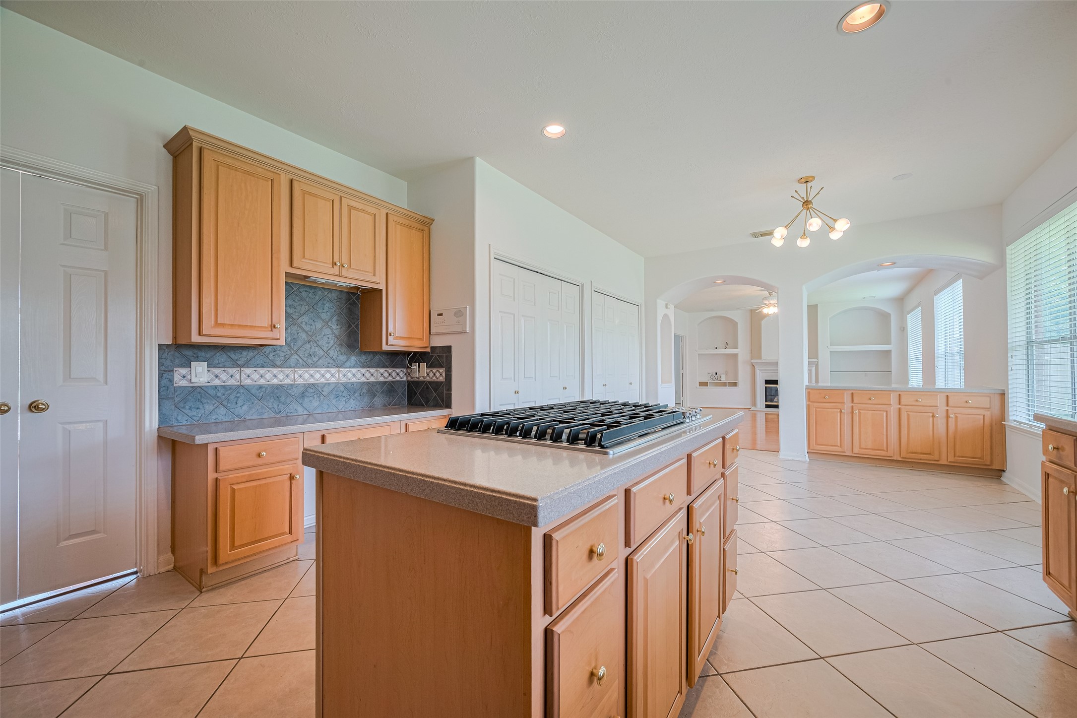 9218 Memorial Pines Way Spring, TX 77379 - Photo 8 of 39 This spacious kitchen features abundant storage, including two large, fully-shelved pantry closets.