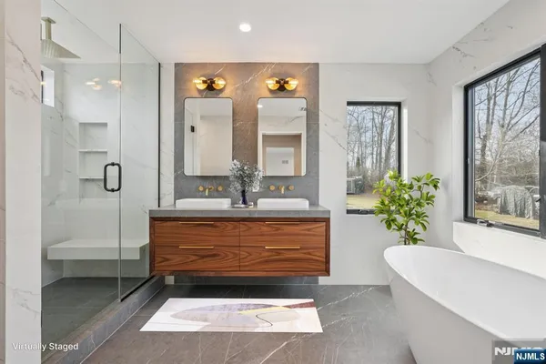 a bathroom with a tub shower and sink