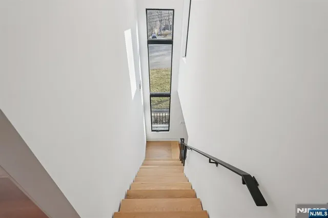 a view of a hallway with a white walls