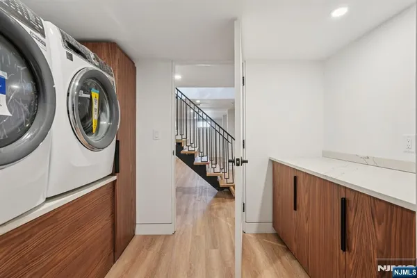 a view of a hallway with washer and dryer