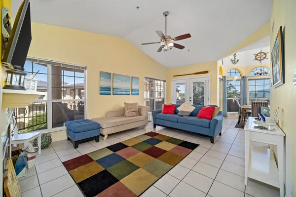 a living room with a fireplace and a flat screen tv
