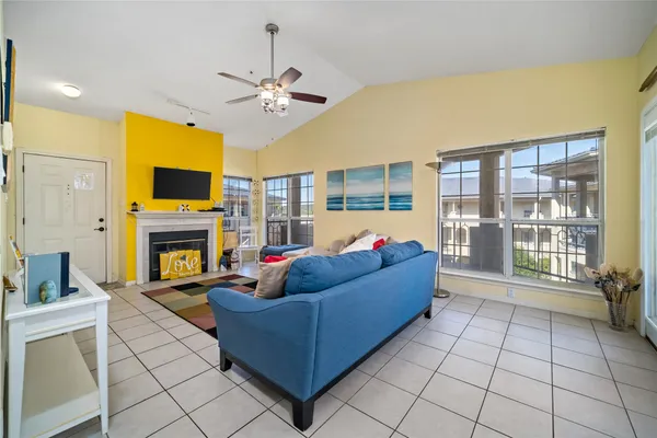 a living room with furniture and a fireplace