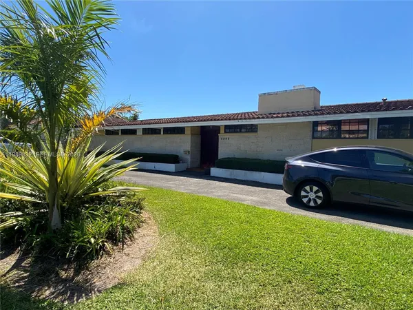 a car parked in front of a house