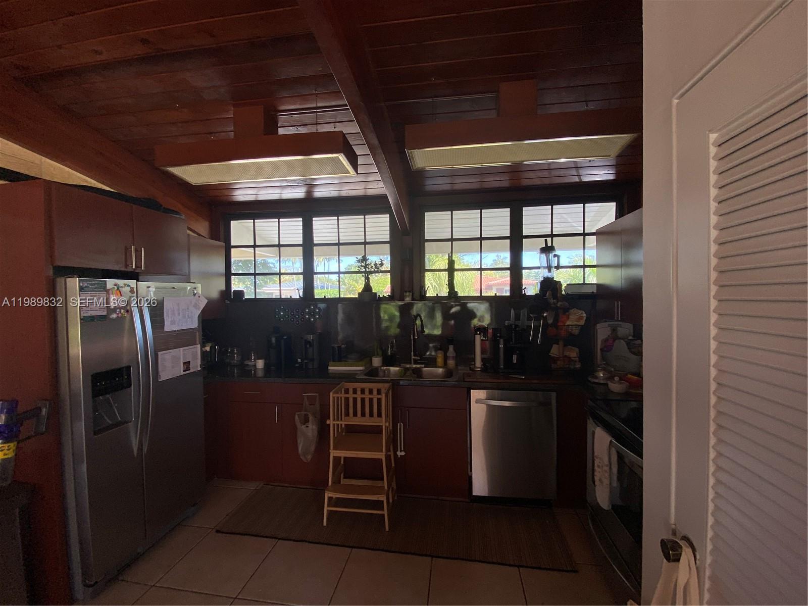 5900 Southwest 34th Street Miami, FL 33155 - Photo 4 of 4 a kitchen with refrigerator and window