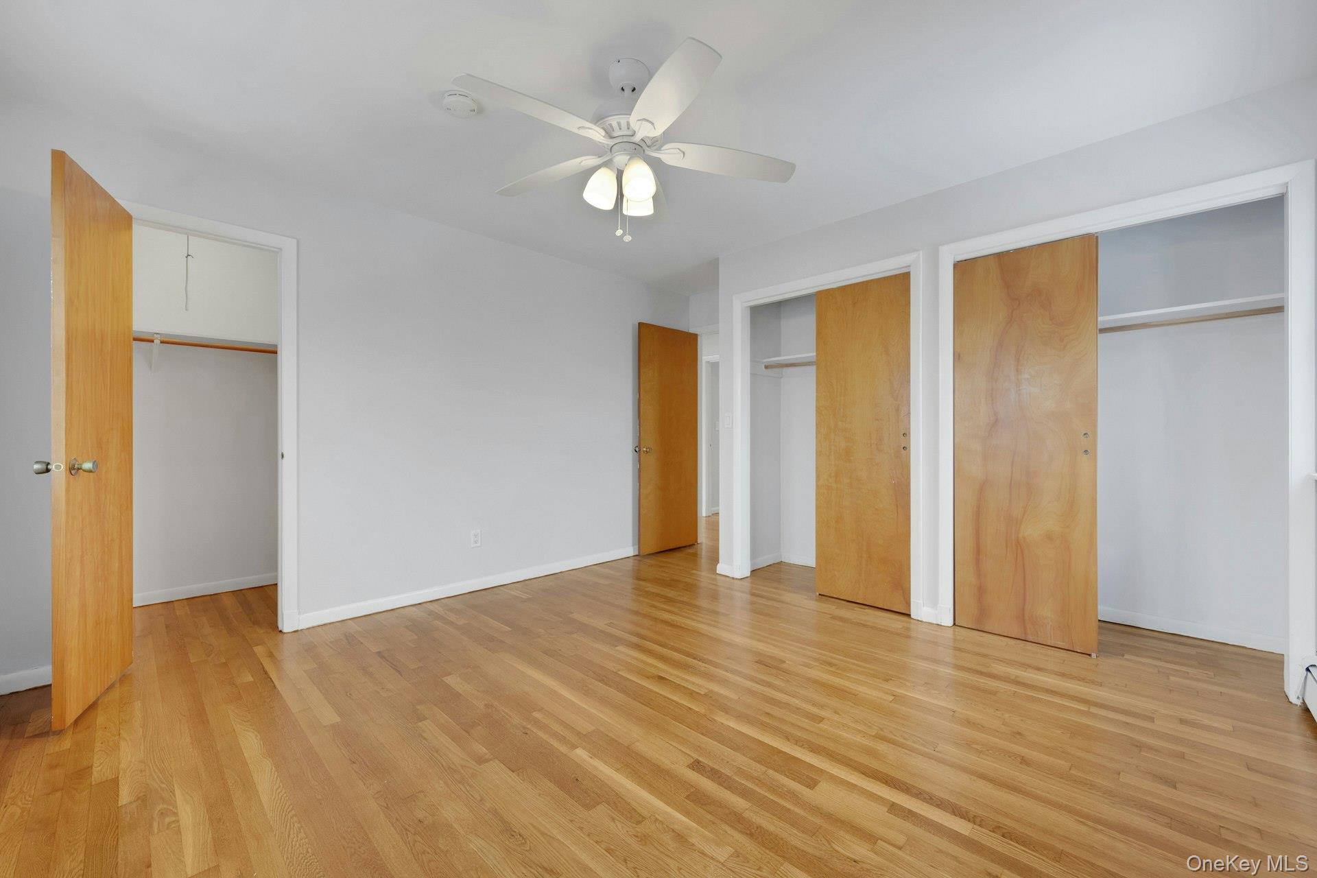 52 Post Place, Unit 2 Harrison, NY 10528 - Photo 16 of 23 a view of an empty room with wooden floor