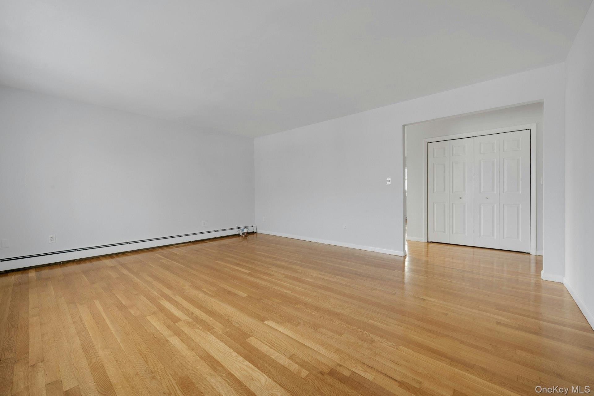 52 Post Place, Unit 2 Harrison, NY 10528 - Photo 5 of 23 a view of an empty room and wooden floor