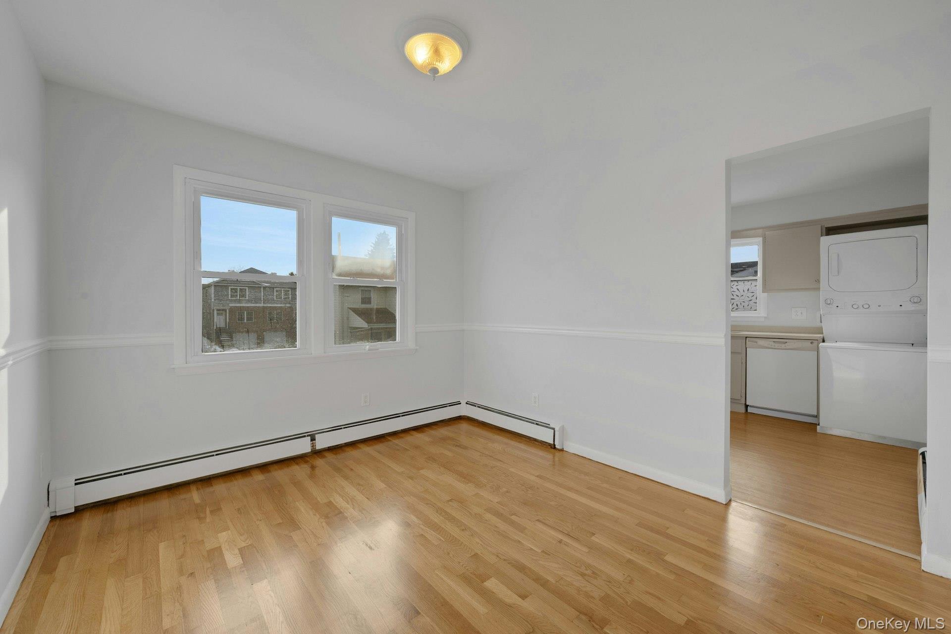 52 Post Place, Unit 2 Harrison, NY 10528 - Photo 6 of 23 a view of empty room with wooden floor and fan
