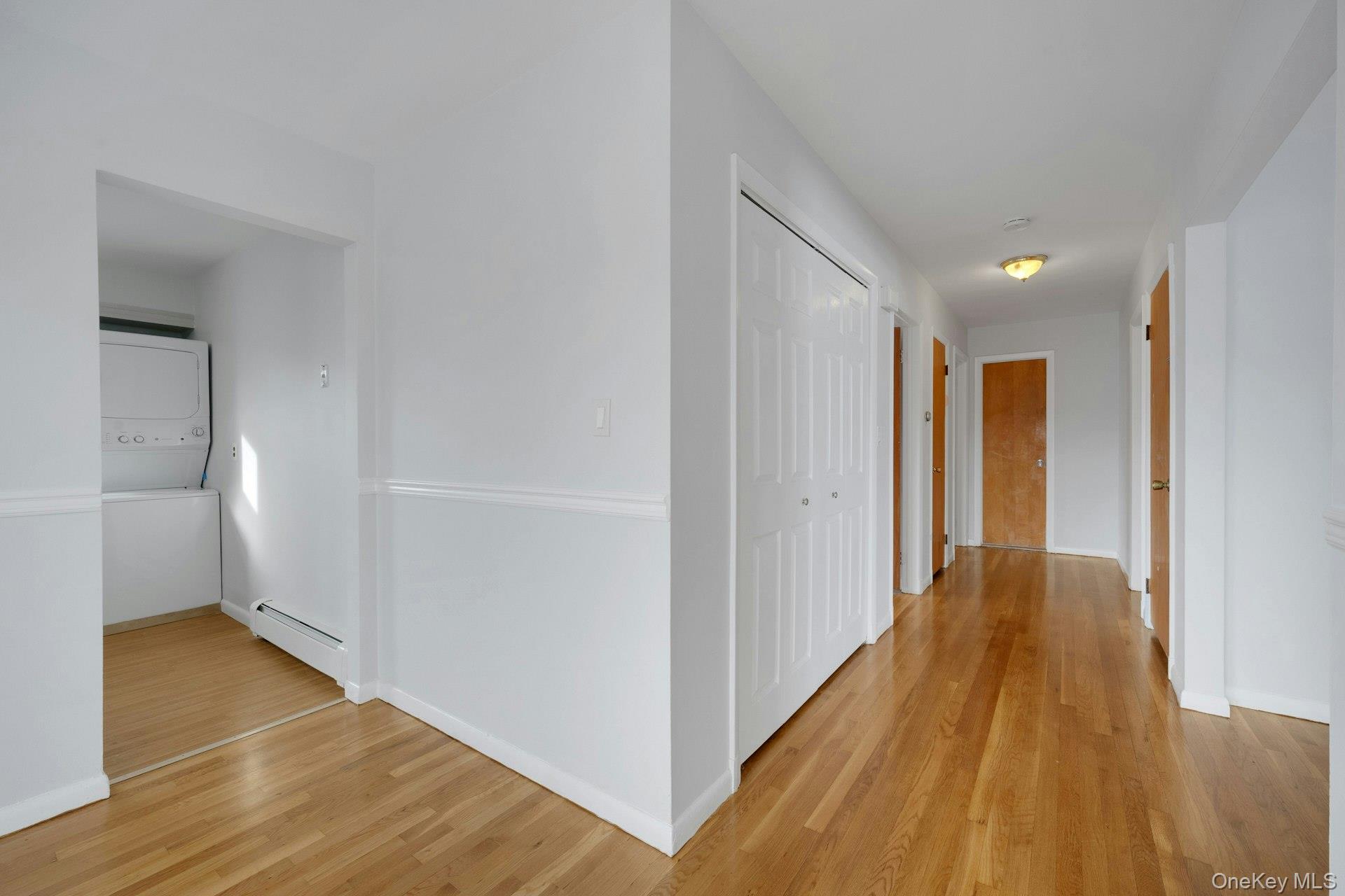 52 Post Place, Unit 2 Harrison, NY 10528 - Photo 8 of 23 a view of a hallway with wooden floor