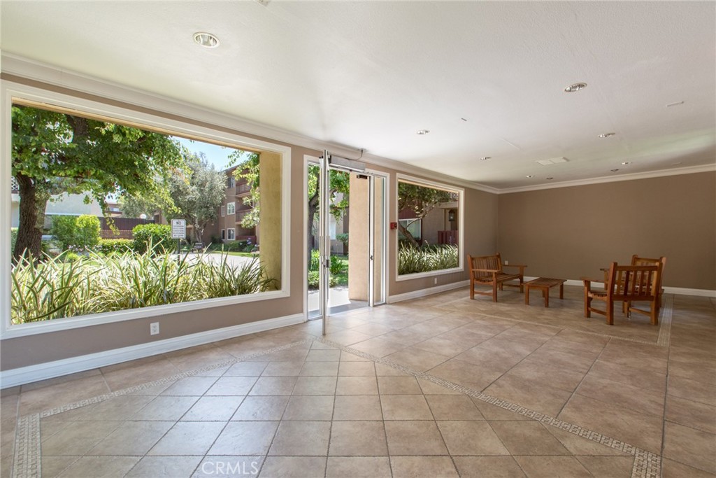 12200 Montecito Road, Unit D213 Seal Beach, CA 90740 - Photo 4 of 8 a view of an empty room with windows