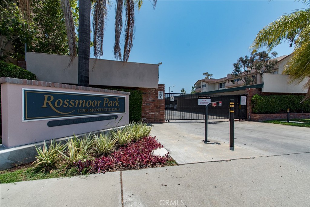 12200 Montecito Road, Unit D213 Seal Beach, CA 90740 - Photo 8 of 8 a sign that is sitting in front of flowers