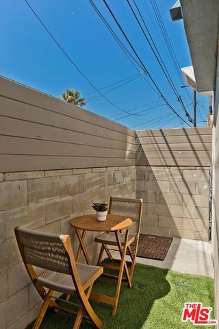 a dining room with furniture and a window