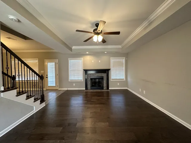 wooden floor in an empty room with a fireplace