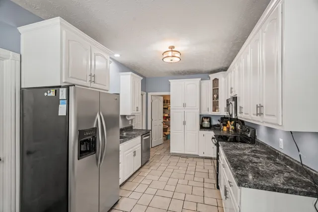 a dining room with furniture window and outside view