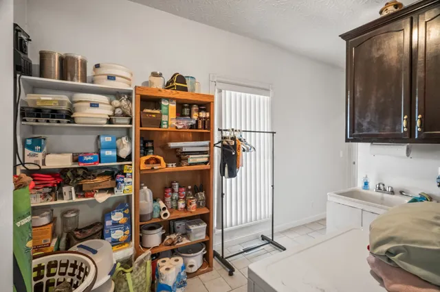 a view of a house with sitting area and garden