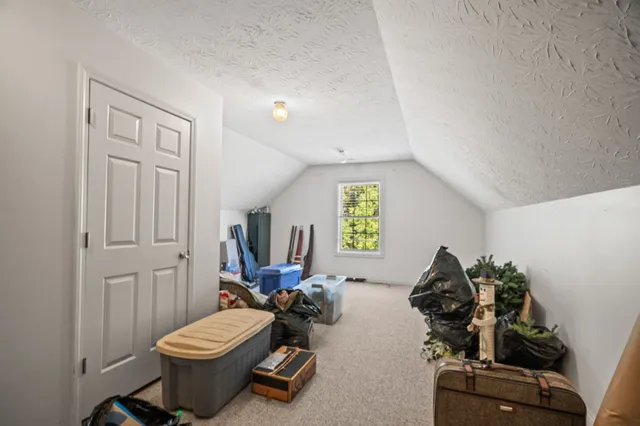 a view of a wooden deck and a yard