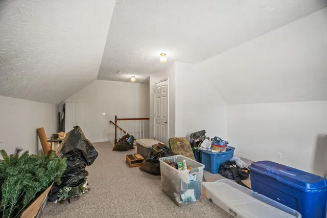 an aerial view of a house with garden space and street view