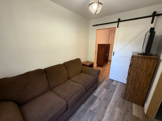 a bedroom with a bed and cabinets