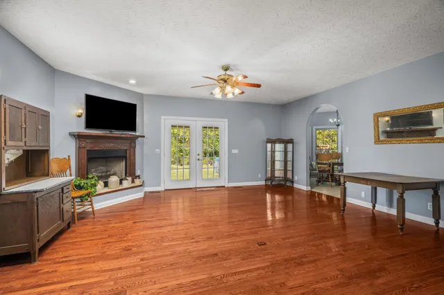 a living room with furniture and a flat screen tv