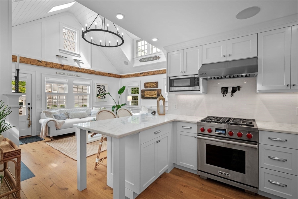 31 Franklin Street Marblehead, MA 01945 - Photo 15 of 35 a kitchen with a stove oven and a refrigerator