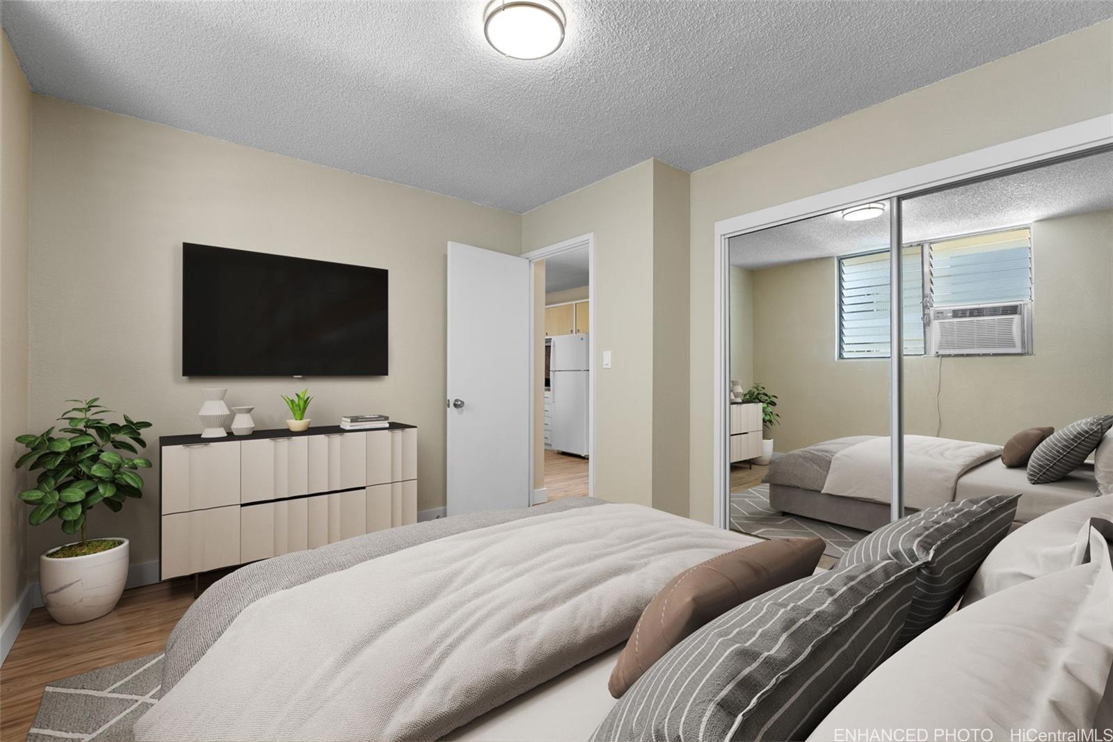 814 Kinau Street, Unit 401 Honolulu, HI 96813 - Photo 14 of 23 a bedroom with two bed and a flat screen tv