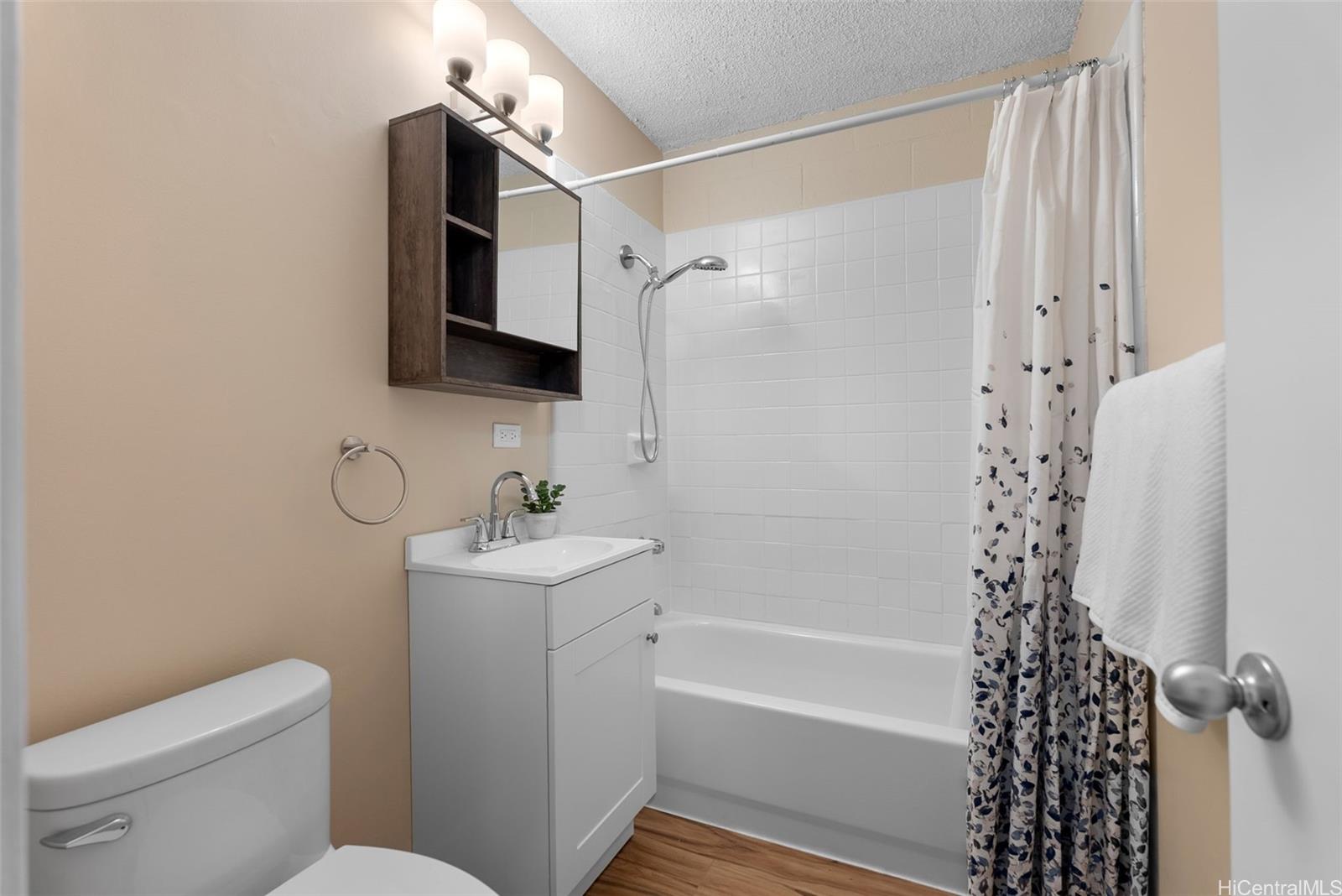 814 Kinau Street, Unit 401 Honolulu, HI 96813 - Photo 19 of 23 a bathroom with a sink a toilet and shower