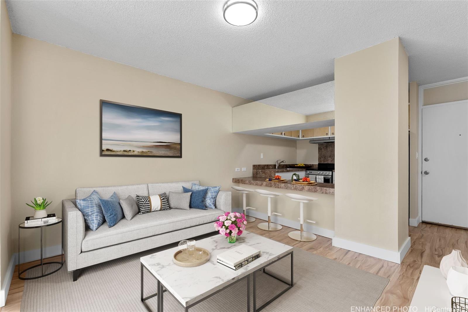 814 Kinau Street, Unit 401 Honolulu, HI 96813 - Photo 3 of 23 a living room with furniture and a wooden floor