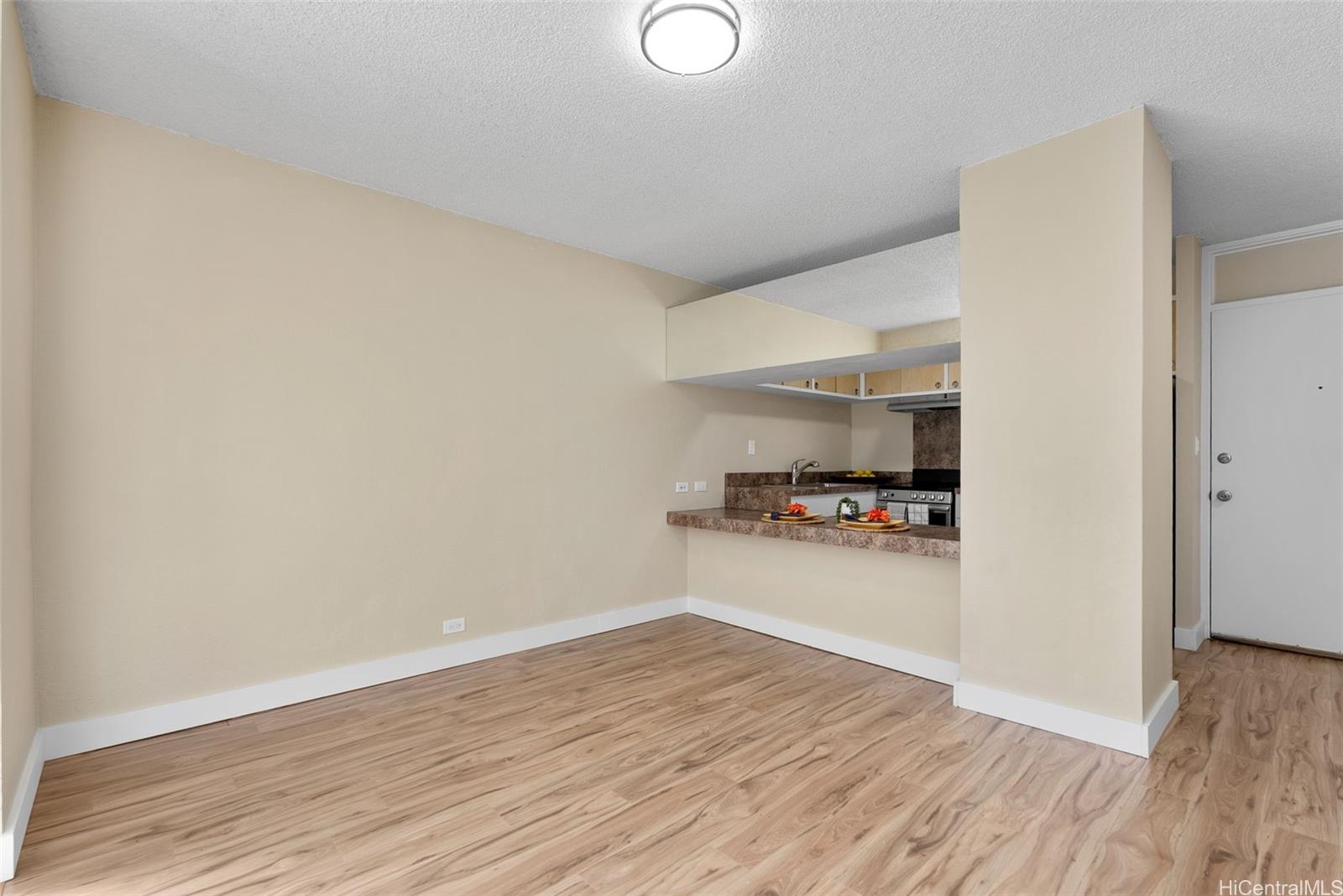814 Kinau Street, Unit 401 Honolulu, HI 96813 - Photo 4 of 23 a view of empty room with wooden floor
