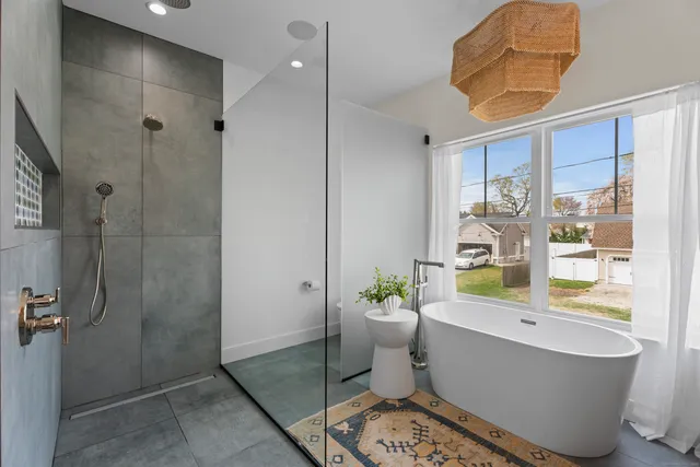 a bathroom with a sink mirror toilet and shower