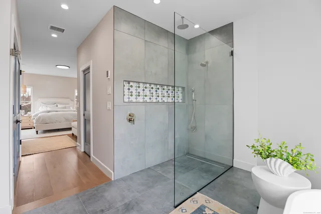 a bathroom with a shower and a tub