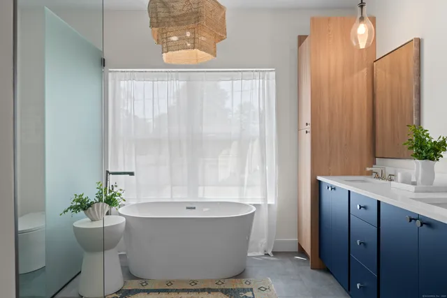 a bathroom with a bathtub and sink