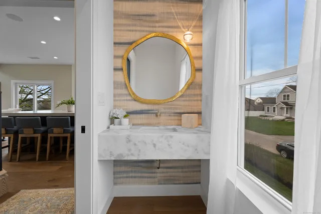 a bathroom with a sink and a mirror