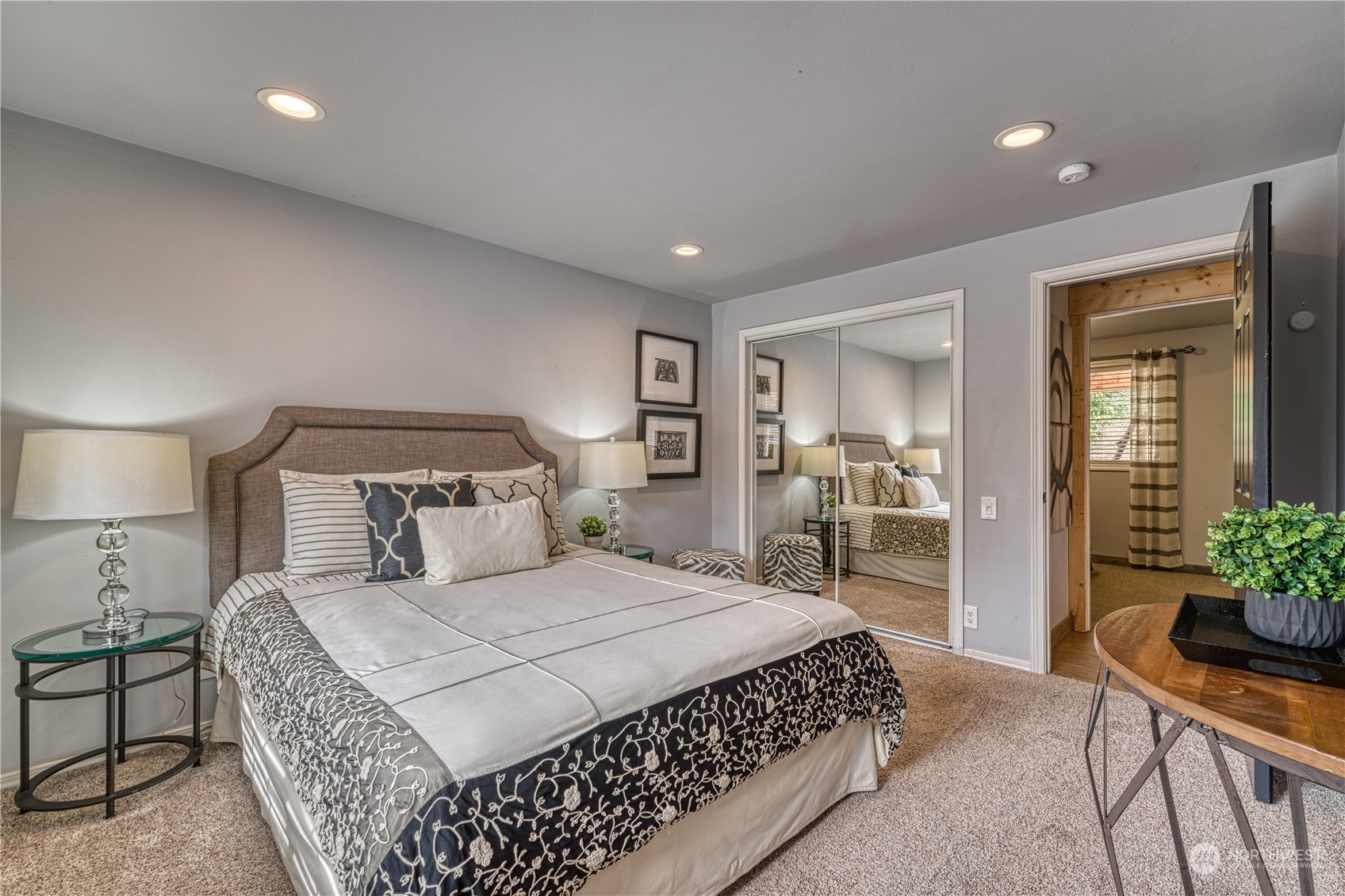 2208 Camas Circle Southeast Renton, WA 98055 - Photo 8 of 37 a bedroom with a large bed and a chandelier