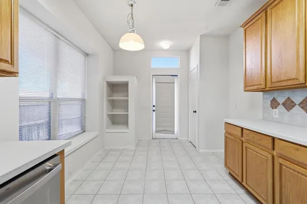 a view of a kitchen with electric appliances