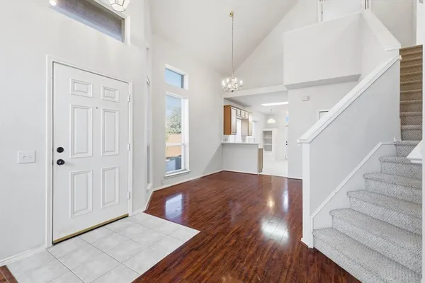 a view of an entryway with wooden floor