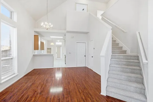a view of an entryway with wooden floor