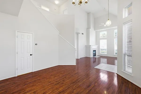 a view of livingroom with hardwood floor and hallway