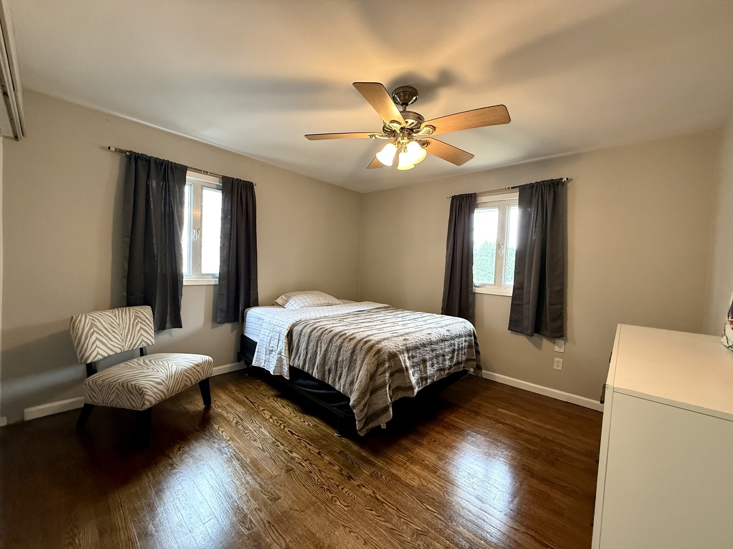 509 Broadmeadow Road Rantoul, IL 61866 - Photo 11 of 18 a spacious bedroom with a bed and a chandelier