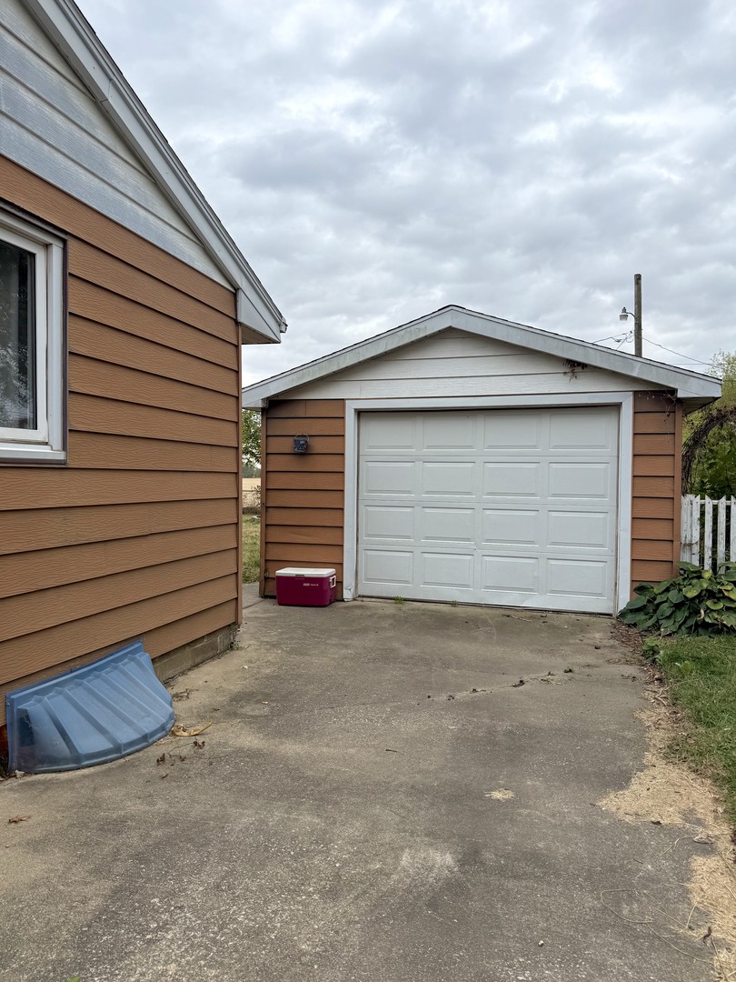 509 Broadmeadow Road Rantoul, IL 61866 - Photo 17 of 18 a small white house with a outdoor space