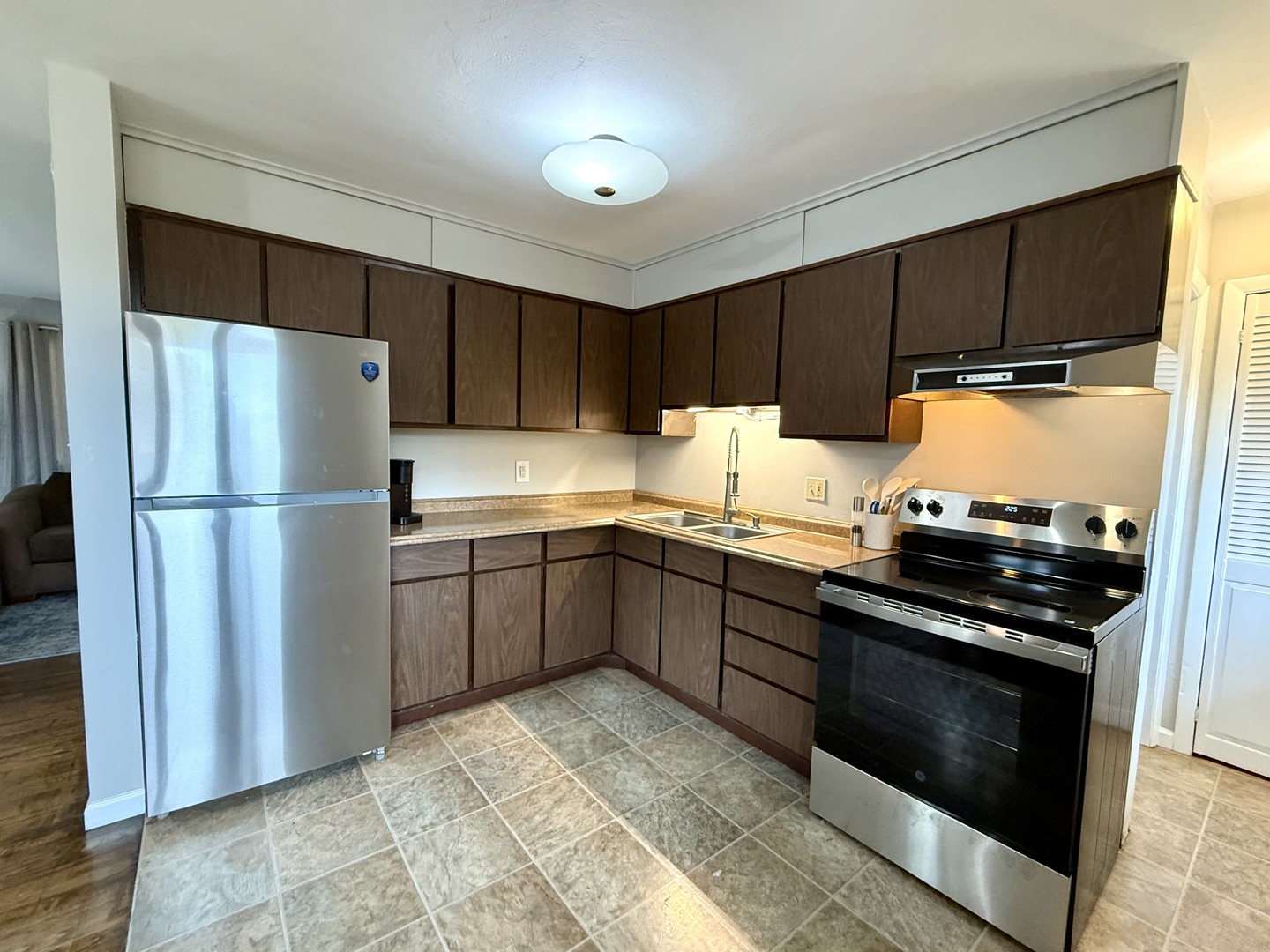 509 Broadmeadow Road Rantoul, IL 61866 - Photo 8 of 18 a kitchen with a refrigerator stove and cabinets