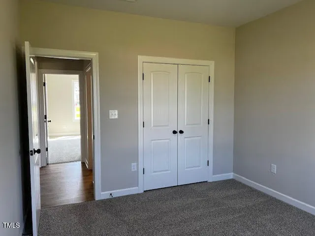 a view of entryway with wooden floor and stairs