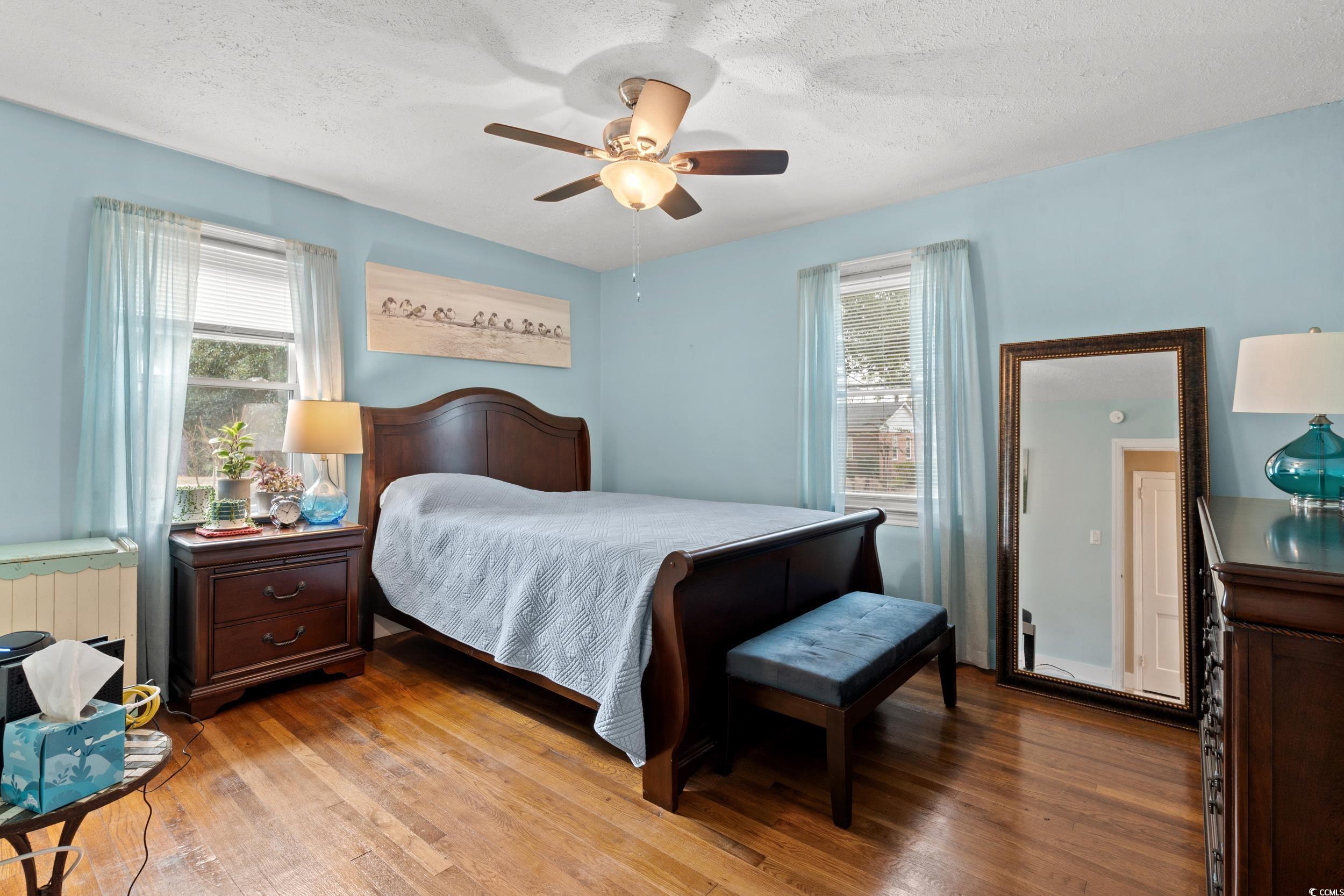324 Edgewood Circle Conway, SC 29527 - Photo 13 of 31 Bedroom with a textured ceiling, hardwood / wood-style floors, and a ceiling fan